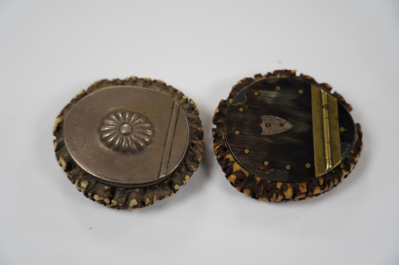 Two 19th century Scottish staghorn snuff boxes. one inscribed 'Mills, THE GIFT of Mr Bedford', with horn lid, 6.5cm, the other with white metal mounts, 6.5cm and a straw-work box, 8.5cm. Condition - staghorn boxes good,